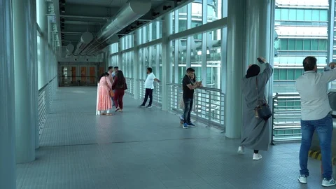 Tourists from different countries on the observation deck of the Petronas Stock Footage 111233436