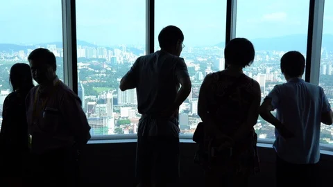 Tourists from different countries on the observation deck of the Petronas Stock Footage 111233876