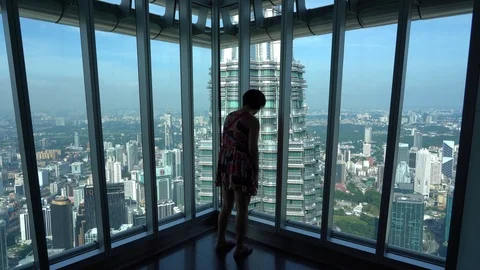 Tourists from different countries on the observation deck of the Petronas Stock Footage 111233888