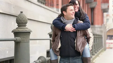 Tourists doing piggy back ride in city Stock Footage 33079910