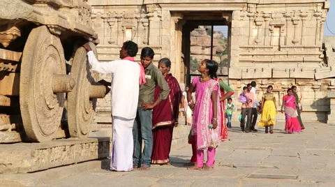 Tourists doing sightseeing ruins of temple in Hampi. Stock Footage 49937398