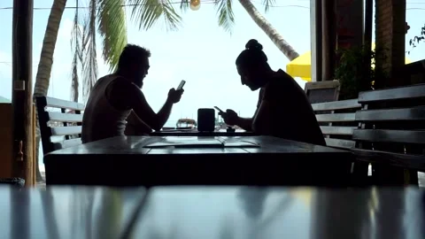 Tourists drinking in a terrace bar during the summer Stock Footage 130398097