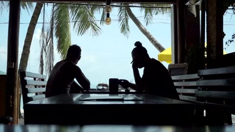 Tourists drinking in a terrace bar during the summer Stock Footage 130398099