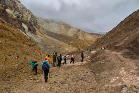 Tourists during the ascent to the active volcano Mutnovsky in Kamchatka. Stock Photos