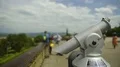 Tourists enjoying city panorama on observation deck with public binoculars HD Footage
