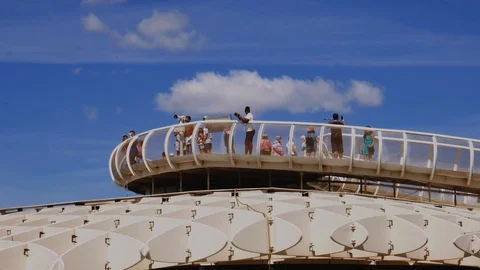 Tourists enjoying the panoramic view of Seville from the viewing deck of the Stock Footage 116242520