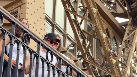 Tourists enjoying panoramic views from Eiffel Tower observation deck Stock Footage 334134013