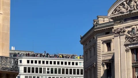 Tourists enjoying panoramic views from a rooftop in Paris Stock Footage 337783384