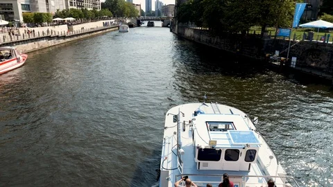Tourists enjoying sun deck on sightseeing tour boat on Spree river in Berlin Video stock 116250859