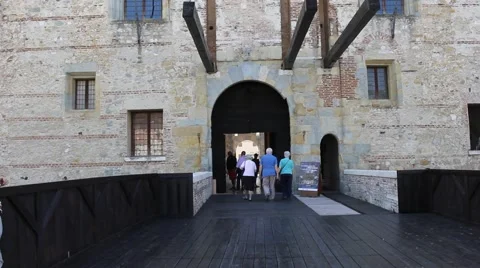 Tourists entering a castle Stock Footage 66964271