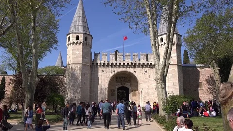 Tourists entering the gate of Salutation of Topkapi Palace, Istanbul Stock Footage 75621863