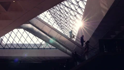 Tourists on escalator inside the Louvre Stock Footage 182867765