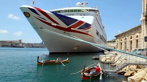 Tourists on excursion boat explore landmarks near cruise ship in Valletta, Malta Video stock 72256737
