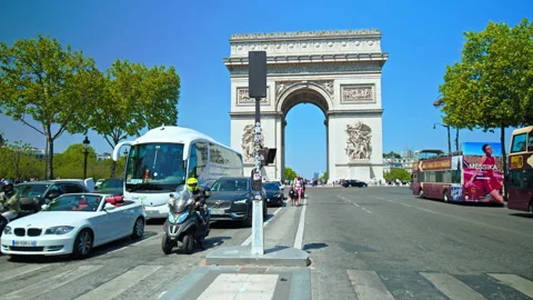 Tourists explore the Iconic triumphal arch on a sunny day in Paris, France. Stock Footage 245454104