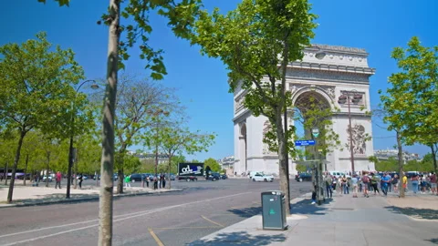 Tourists explore the Iconic triumphal arch on a sunny day in Paris. Stock Footage 245454140