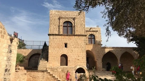 Tourists Explore Monastery Courtyard. Ayia Napa Monastery, Cyprus Stock-Footage 90817795