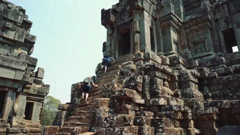 Tourists Exploring Ancient Stone Ruins at Angkor Wat Cambodia Video stock 340016353