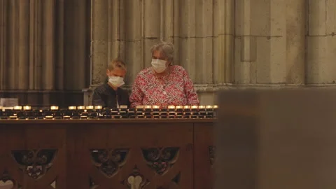 Tourists exploring and pray at the Cologne Cathedral Stock Footage 325093393