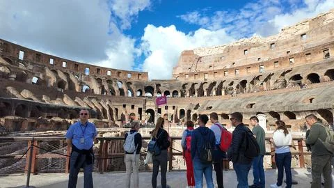 Tourists Exploring the Colosseum's Interior Stock Photos