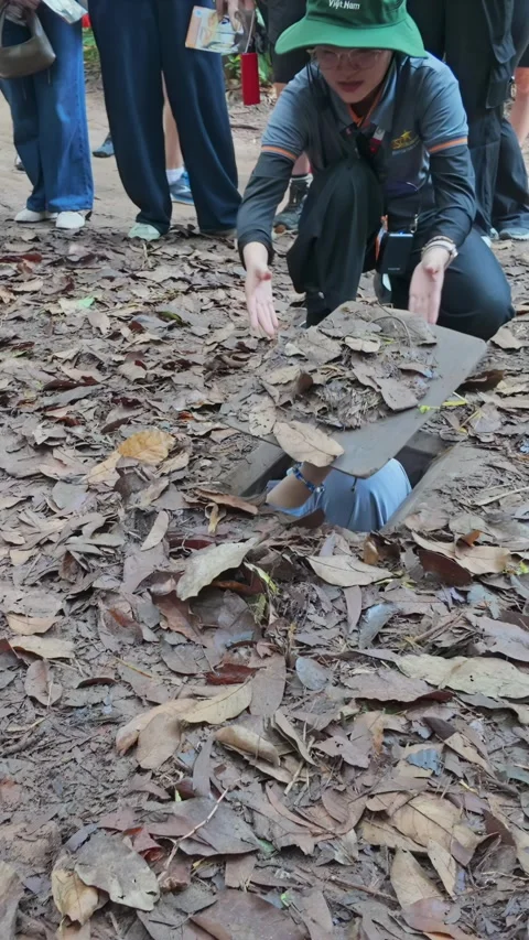 Tourists exploring Cu Chi Tunnels, Ho Chi Minh City, Vietnam Stock Footage 335050878