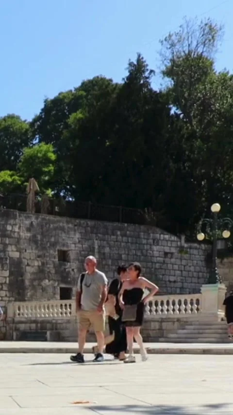 Tourists  exploring Five Wells Square and Petar Zoranic Square in Zadar, Croatia Stock Footage 330158463