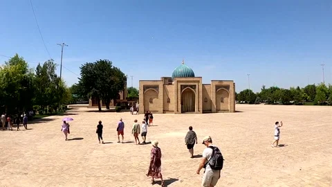 Tourists exploring Hazrati Imam square and Muyi Muborak madrasah in Tashkent Stock-Footage 335080177