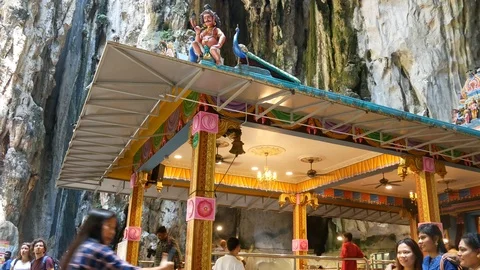Tourists Exploring the Interior of the Sacred Batu Caves in Malaysia Stock Footage 124140694