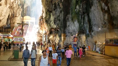 Tourists Exploring the Interior of the Sacred Batu Caves in Malaysia Stock Footage 124140782