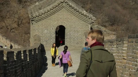 Tourists Exploring Mutianyu Great Wall Watchtower in Beijing, China Stock Footage 345824389