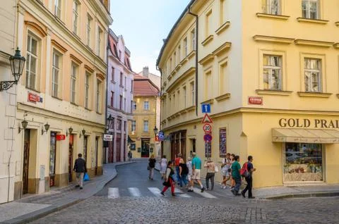 Tourists exploring the old streets lined with beautiful buildings in Prague,  Stock Photos