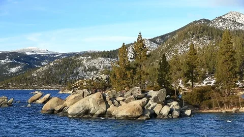 Tourists Exploring the Shore Line of Lake Tahoe at Sand Harbor in Winter Stock Footage 101459015