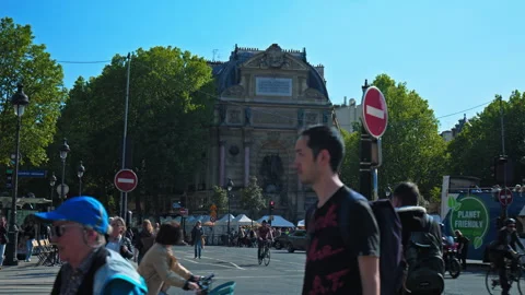 Tourists exploring the streets of Gothic-style Notre Dame Cathedral. Stock Footage 245453362