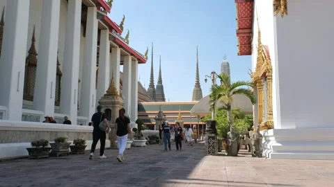 Tourists exploring Wat Pho grounds in Thailand Stock Footage 276187658