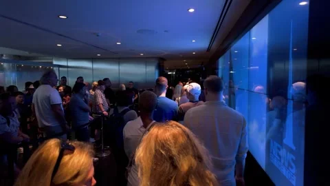 Tourists in the express line to ride the elevator at the Burj Khalifa in Dubai Stock Footage 304342128