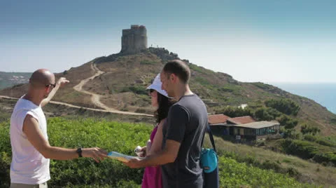 Tourists finding their location the map Stock Footage 26109089