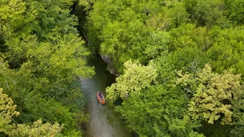 Tourists float on a rubber boat along the martvili canyon Georgia Stock Footage 168616937