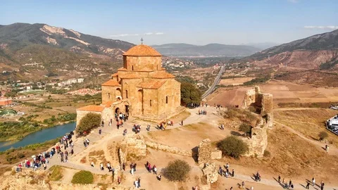 Tourists Flock around Jvari Monastery in Georgia, from Aerial Perspective 库存影片 102509790
