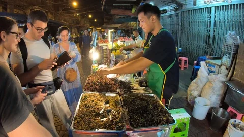 Tourists at fried insect trolley Stock-Footage 105508138