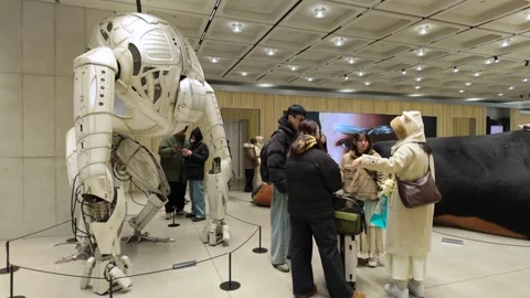 Tourists in front of Alien robot, gentle monster, Seoul, South Korea - 4K Stock Footage 339756047
