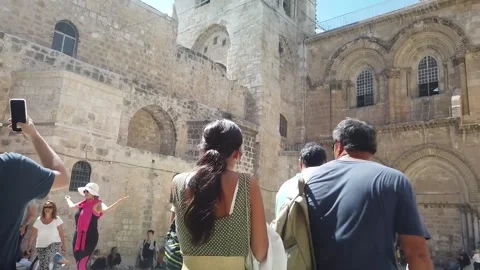 Tourists on the front of the holy sepulchre in Jerusalem Stock Footage
