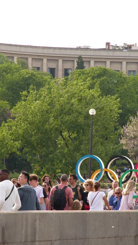 Tourists Gather Near Large Interlocking Rings at Trocadero Palace in Paris Stock Footage 336519583