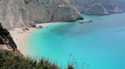 Tourists getting down the beach of heaven Stock Footage 25178974