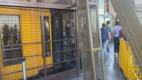 Tourists getting out of an elevator of the Eiffel Tower in Paris, France Stock Footage 200867910