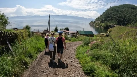 Tourists go down the path to Lake Baikal Stock Footage 254010066
