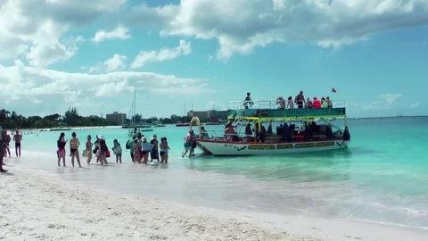 Tourists going on diving ship excursion, Barbados beach Stock Footage 75495380