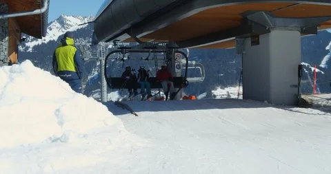 Tourists Going on a Ski Adventure After Getting Down from the Cable Car in Alps Stock Footage 129894420