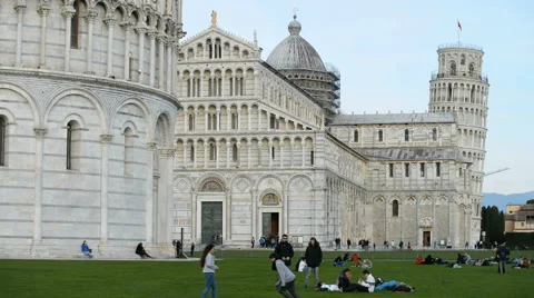 Tourists on the grass with cathedral in the background, Pisa, Tuscany, Italy Stock Footage 62091353