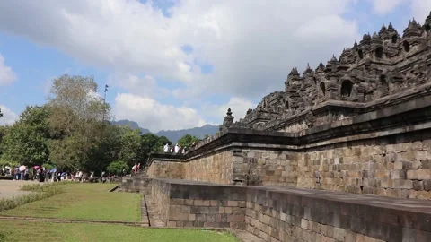 Tourists on the grounds of Borobudur Temple, Java, Indonesia Stock Footage 245264703