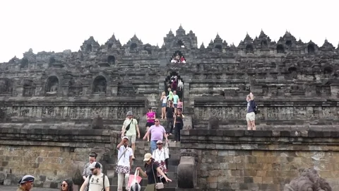 Tourists on the grounds of Borobudur Temple, Java, Indonesia. Stock Footage 245264749