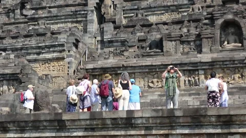Tourists on the grounds of Borobudur Temple, Java, Indonesia. Stock Footage 245264775